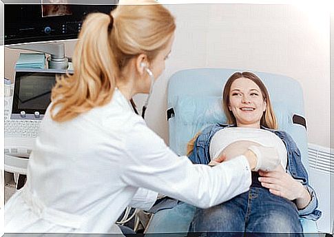 doctor examining pregnant woman