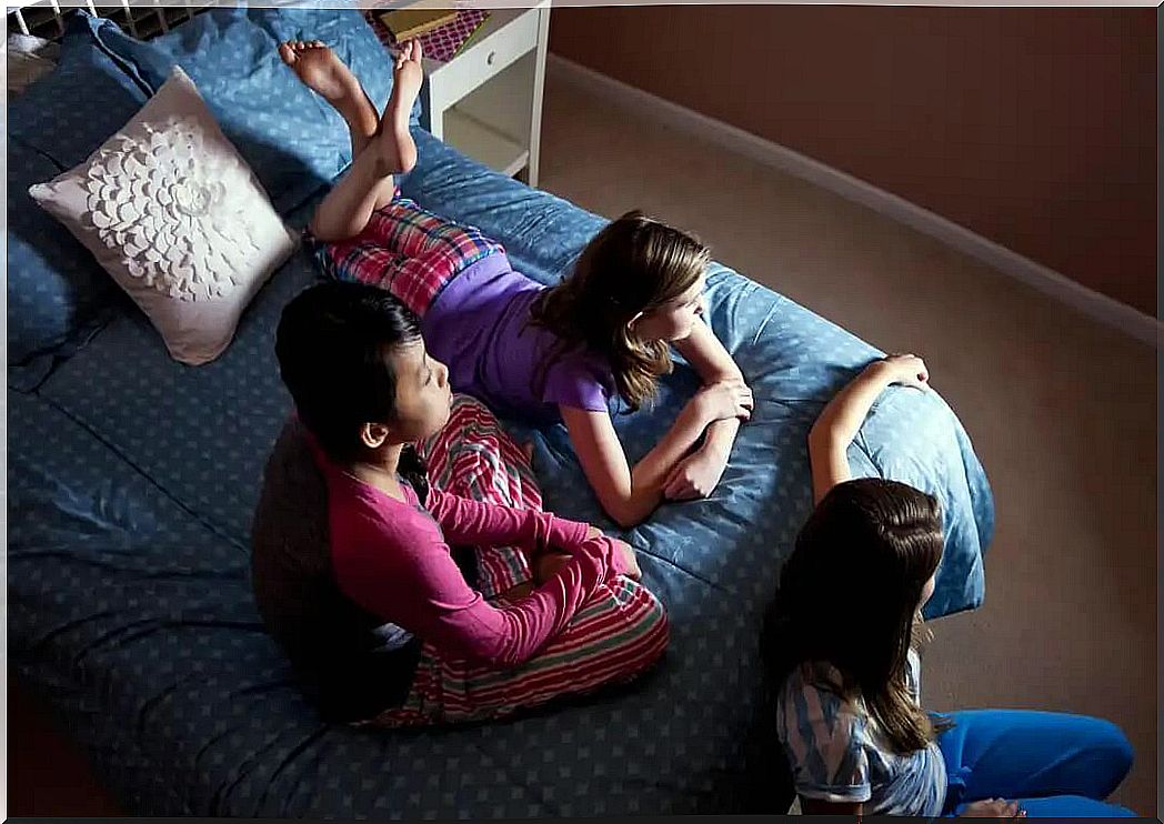 Children watching movies at a sleepover.