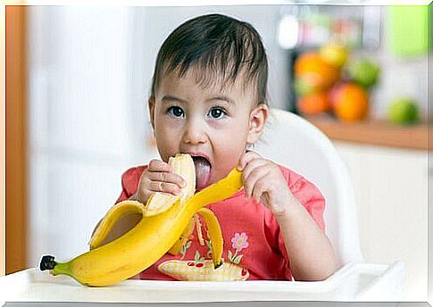 baby eating banana