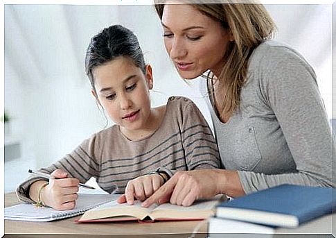 mother teaching her daughter, helping her son to study