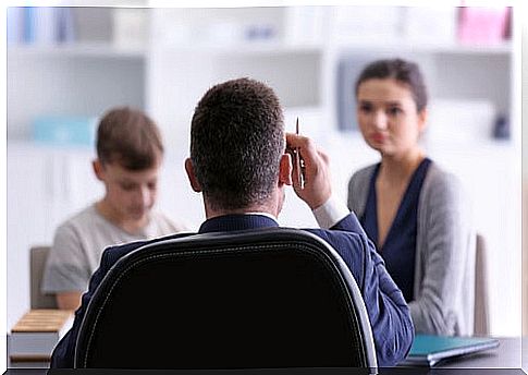 mother and son having teacher meeting