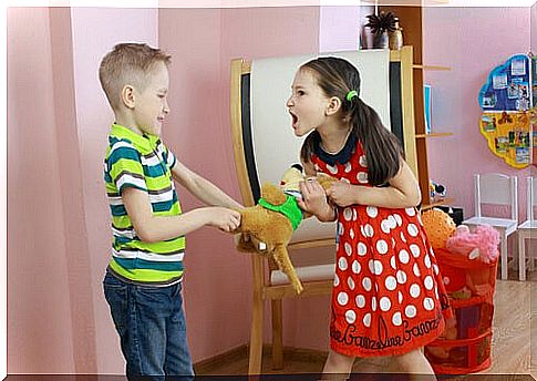 children fighting over a stuffed animal