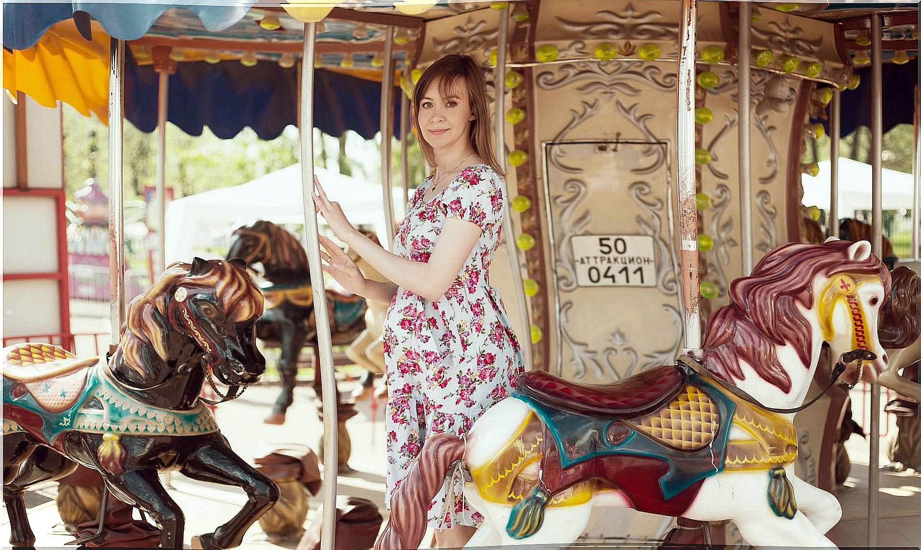 pregnant mother on a carousel