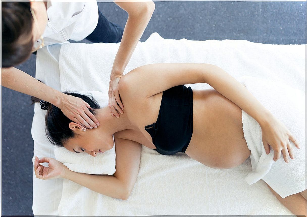 Woman getting massage during pregnancy.