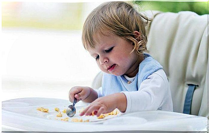 child eating on their own