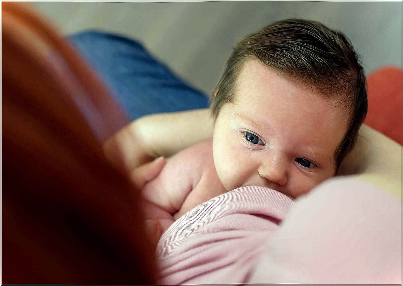 Baby nursing at the mother's breast during lactation.